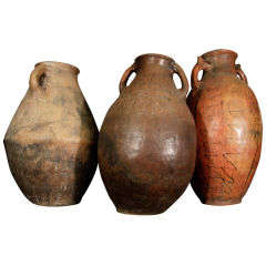 Set of three terra-cotta jars
